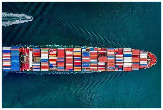 Our Mission - Container ship navigating ocean